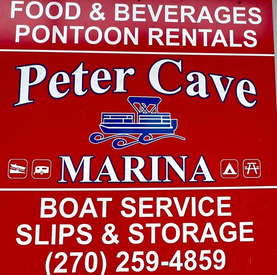 Peter Cave Marina sign listing pontoon rentals, boat service, slips and storage